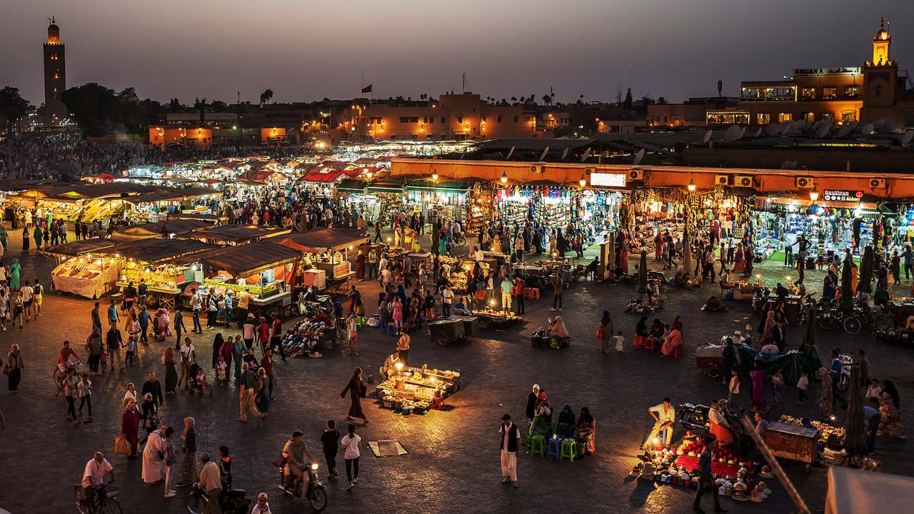 [the Jemaa el-Fnaa market place at night]